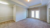 This 990 square foot single-floor residence in Glenmoore, PA, offers a practical and comfortable living space. The property features two bedrooms, including a generous 220 square foot primary bedroom, and two full bathrooms. The kitchen is a highlight, showcasing white cabinetry, contrasting golden countertops, and modern appliances including a refrigerator, stove, and built-in microwave. The galley-style layout maximizes efficiency while providing ample storage and preparation space.

Throughout the home, neutral tones create a bright and inviting atmosphere. The living areas boast plush carpeting, while the kitchen and bathrooms feature durable wood-look flooring. The bathrooms are equipped with essential fixtures, including a bathtub in at least one. An in-unit laundry room adds convenience to daily life.

Large windows in the bedrooms allow for natural light, enhancing the sense of space. The property also includes a closet for additional storage. The overall design emphasizes functionality and comfort, making efficient use of the available square footage. This home presents an ideal option for those seeking a low-maintenance living space with modern amenities in a suburban setting.