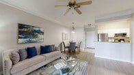 Located in Largo, FL, this well-appointed one-bedroom, one-bathroom residence offers a smart, efficient layout across a single floor. The open-concept living and dining area is bright and inviting, featuring crown molding, light wood-style flooring, and a ceiling fan. A large sliding glass door floods the space with natural light and opens to a private patio overlooking tropical greenery, bringing the outdoors in. The kitchen is designed for functionality and style, showcasing white cabinetry, granite countertops, stainless steel appliances, and light wood-look tile flooring. A distinctive arched passageway connects the kitchen to the dining area, adding an elegant architectural touch. The bedroom is a calm retreat with soft carpeting, a ceiling fan, and a window that allows for natural light. It includes a dedicated walk-in closet with built-in shelving, providing generous storage. The bathroom features a white vanity with granite countertops, wood-look vinyl flooring, and a tiled shower-tub combination with decorative accent tiles. A hallway and additional closet space further enhance the practicality of this well-organized residence, making it an ideal home for those seeking comfort and convenience in the Largo area.