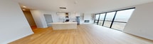 This contemporary residence at 112 St James Street, London ON, offers 2130 square feet of meticulously designed living space on a single floor. The home boasts 4 bedrooms, including a spacious 250 sq ft primary suite, and 5 bathrooms, ensuring comfort and privacy for all occupants. The open-concept layout seamlessly integrates the kitchen and living areas, creating a fluid space ideal for both everyday living and entertaining.

The kitchen is a standout feature, showcasing sleek white cabinetry, ample storage, and high-end appliances. Light-colored quartz countertops complement the modern aesthetic, while under-cabinet lighting adds both functionality and ambiance. The living areas are graced with warm wood flooring, creating a cohesive flow throughout the home.

Large windows are a prominent feature, flooding the rooms with natural light and offering picturesque views of the surroundings. The bathrooms are elegantly appointed, with one featuring a stylish combination of white tile work and contrasting dark fixtures. A dedicated laundry room with stacked, modern appliances adds convenience to daily life.

The property's design emphasizes clean lines, neutral tones, and a minimalist approach, creating a sense of spaciousness and serenity. With its thoughtful layout and high-quality finishes, this home represents the epitome of contemporary urban living.