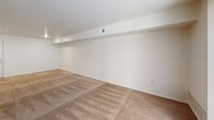 Located at 3740 Winchell Ave in Kalamazoo, MI, this two-bedroom, one-bathroom residence offers a well-organized single-floor layout designed for comfortable, everyday living. The combined living and dining area is the heart of the home, featuring neutral-toned carpet, a textured ceiling, and a large sliding glass door with vertical blinds that floods the space with natural light and provides outdoor views. A raised soffit detail adds architectural definition to the open area. The kitchen is outfitted with white cabinetry, light countertops, a full suite of white appliances including a range, dishwasher, and refrigerator, and durable wood-look flooring that extends through the functional work area. The primary bedroom is a spacious retreat with carpeted flooring, a walk-in closet featuring built-in shelving, and an additional doorway providing convenient access. The second bedroom also features plush carpet and a bifold closet door. The full bathroom includes a tub/shower combo, a vanity with light countertops, a large mirror, and wood-look flooring. Throughout the home, five closets provide exceptional storage. A connecting hallway ties all areas together efficiently, completing this well-appointed residence.