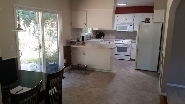 Kitchen viewed from the dining room. - 4061 NE Brogden St