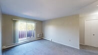 Located at 6903 York Rd in Parma Heights, Ohio, this one-bedroom, one-bathroom unit offers a practical and efficiently organized single-floor layout. The combined living and dining area provides a versatile open space, finished with plush carpeting and a ceiling fan with light fixture. A sliding glass door brings in natural light and opens to a balcony with outdoor views, while a wall-unit air conditioner and baseboard heating ensure year-round comfort. The galley-style kitchen is well-equipped with white cabinetry, a wood-toned countertop, a stainless steel sink, and white appliances including a coil-top range and refrigerator, all set atop durable wood-look flooring. The carpeted bedroom offers a comfortable, cozy atmosphere, complete with a ceiling fan and a large bifold closet for ample storage. Two additional closets throughout the unit provide further organizational flexibility. The full bathroom features classic blue ceramic tile surround on the tub and walls, a pedestal sink, a medicine cabinet with mirror, and tile flooring, reflecting a timeless, clean aesthetic. Neutral wall tones and consistent finishes throughout create a cohesive and move-in ready environment.