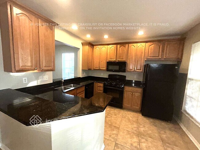 Foto del edificio - 5901 Grand Loneoak Ln