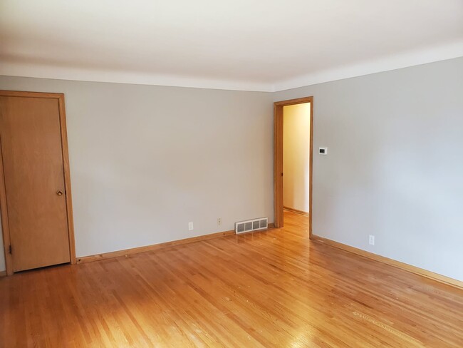 Living room into hallway and bedrooms - 6158 Park Ave