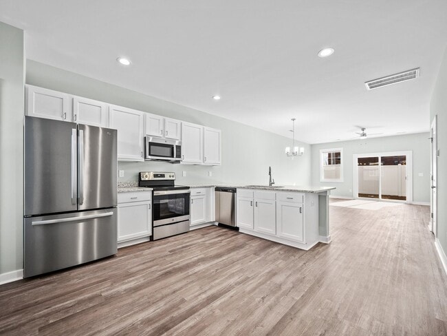 Building Photo - Welcome to Beachside Commons!