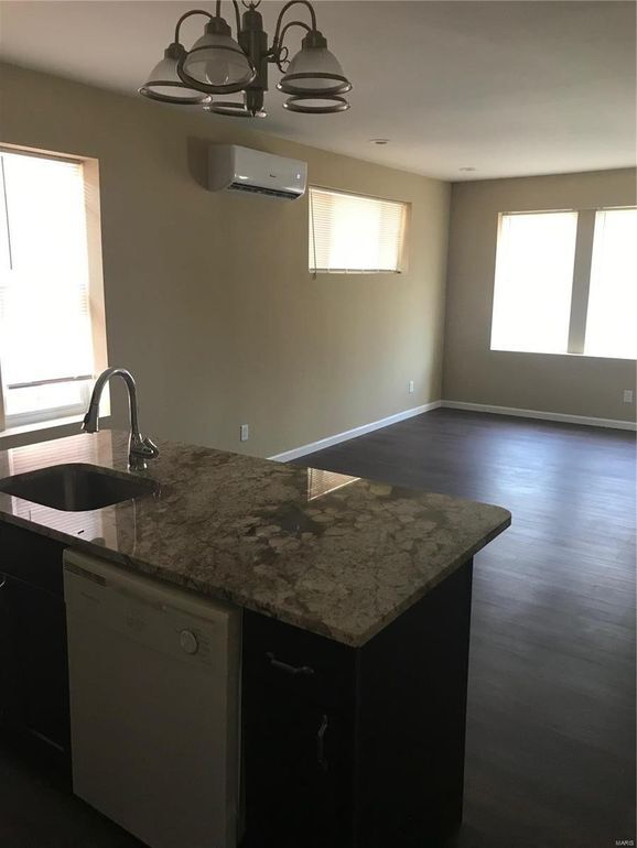 Living room has a balcony off the front - 5855 S Kingshighway Blvd