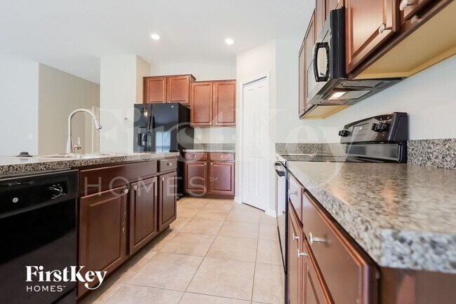 Building Photo - 10606 Strawberry Tetra Dr