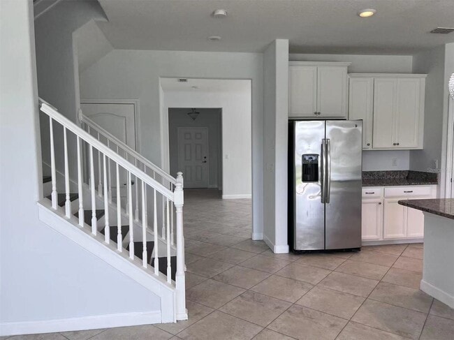 Photo - "Spacious 5-Bed Retreat with Elegant Hardwood & Granite Finishes in Tampa – 3 Full Baths & 3264 S... Apartment