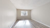 Located at 3430 Kay St in Columbia, South Carolina, this single-floor residence offers a clean, updated interior with a neutral color palette throughout. The open living area is finished with durable wood-look flooring and features a ceiling fan with light fixture, providing both comfort and functionality. Natural light filters in through blinded windows, brightening the space with a warm, inviting atmosphere. Textured popcorn ceilings are consistent across the main living and bedroom areas.

The galley-style kitchen is well-appointed with white cabinetry, granite-patterned countertops, a double sink, and stainless steel appliances including a dishwasher, electric range, and refrigerator. A door at the end of the kitchen provides additional access, enhancing the flow of the layout.

The bedrooms are carpeted for added comfort and each features a window with blinds that allows natural light to brighten the rooms. The bathroom includes wood-look tile flooring, a full soaking tub with a clean white surround, and a towel bar for convenience.

Overall, the space presents a practical and well-maintained layout suited for comfortable everyday living, with consistent finishes and thoughtful details throughout.