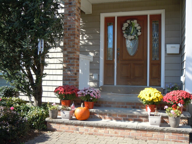 front entrance porch in fall - 103 Summer St