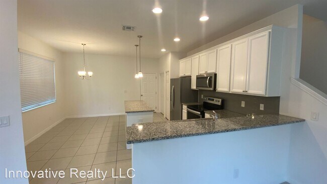 Building Photo - 3 br, 2.5 bath House - 6952 Tussilago Way