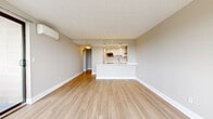 Located at 1 Campbell Ave in West Haven, CT, this well-appointed 2-bedroom, 2-bathroom residence offers a thoughtfully designed single-floor layout. The open-concept living and kitchen area serves as the heart of the home, featuring light wood-style flooring, neutral walls, and a wall-mounted mini-split system. The kitchen is outfitted with white cabinetry, a stainless steel range with a sleek hood vent, a quartz peninsula with pendant lighting, and a clean white countertop that flows seamlessly into the living space.

The spacious primary bedroom is carpeted and features large windows with scenic water views and an individual climate control unit. It is complemented by generous closet storage. The second bedroom also offers carpeting, natural light through wide windows, and its own water views, along with a wall-mounted air conditioning unit.

Both bathrooms are finished with stone-look tile flooring, warm wood vanities, marble-style countertops, and mirrored medicine cabinets. One bathroom includes a tub and shower combination with grab bars. Additional highlights include two hallways, six closets, and a dedicated laundry area, providing ample storage and functionality throughout the home.