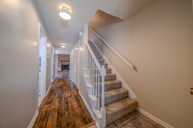 Building Photo - Freshly Updated 2 Bedroom Townhome with Fenced Outdoor Space – Convenient Greensboro Location