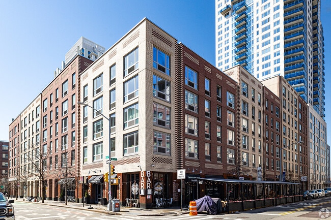 Apartments share the same building as businesses.