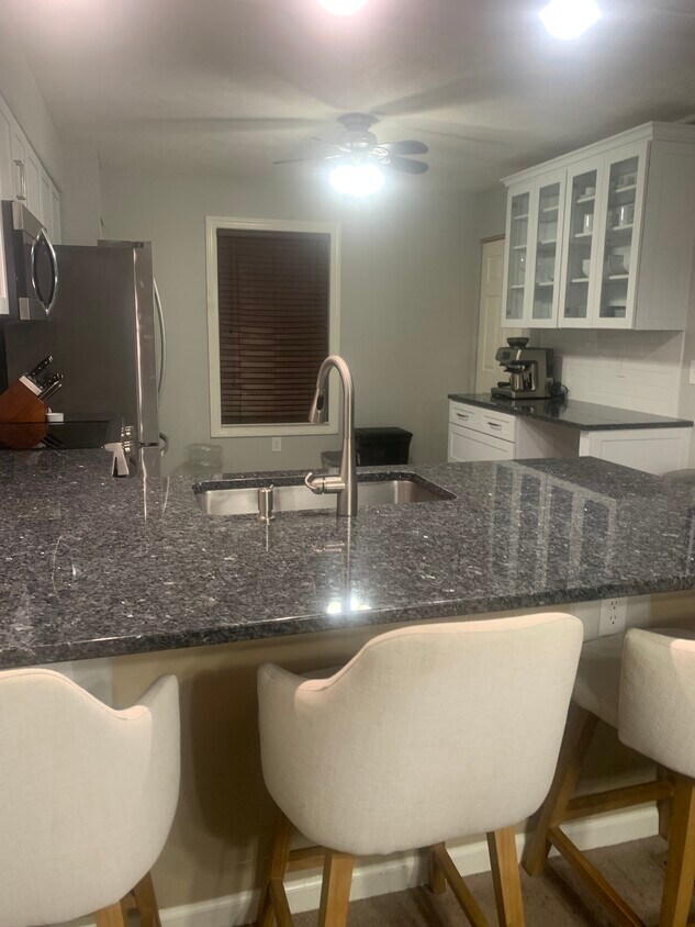 The new kitchen has a walk-in pantry with lots of additional storage. - 704 Carters Grove Dr