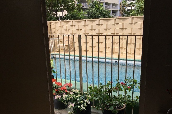 door opens to gated pool - 236 Liliuokalani Ave