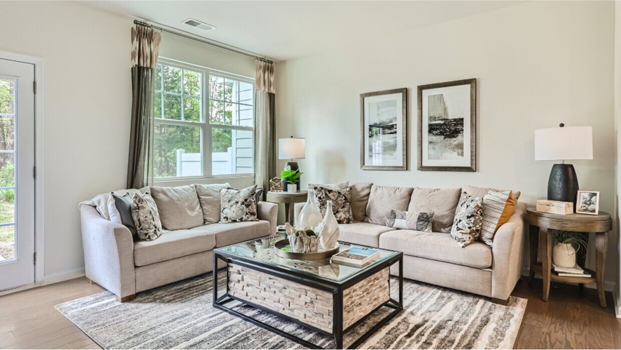 1st floor living room: Immerse yourself in the warmth and comfort of this inviting Living room - 13119 Cottage Crest Ln