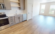 This well-designed 600 square foot apartment in Fargo, North Dakota, offers a perfect blend of comfort and functionality. The single-floor layout comprises one bedroom, one bathroom, and an open-concept kitchen and living area. The primary bedroom, measuring 130 square feet, provides ample space and features plush carpeting and a large window for natural light.

The kitchen is a highlight, boasting modern light-colored cabinetry, stainless steel appliances, and a stylish geometric tile backsplash. The layout is efficient, with ample counter space and storage. Warm wood-toned flooring extends from the kitchen through the living area, creating a seamless and inviting atmosphere.

Large windows in the living room and bedroom offer expansive views and flood the space with natural light, enhancing the apartment's open feel. The bathroom features a pristine white tub-shower combination with built-in shelving for convenience.

A notable amenity is the in-unit laundry room, equipped with a full-sized washer and dryer, complete with overhead shelving for storage. Throughout the apartment, recessed lighting and neutral wall colors contribute to the bright, contemporary ambiance.

Located at 1110 16th Ave S in Fargo, this apartment combines modern living with practical design, making efficient use of its 600 square feet to create a comfortable and stylish home.