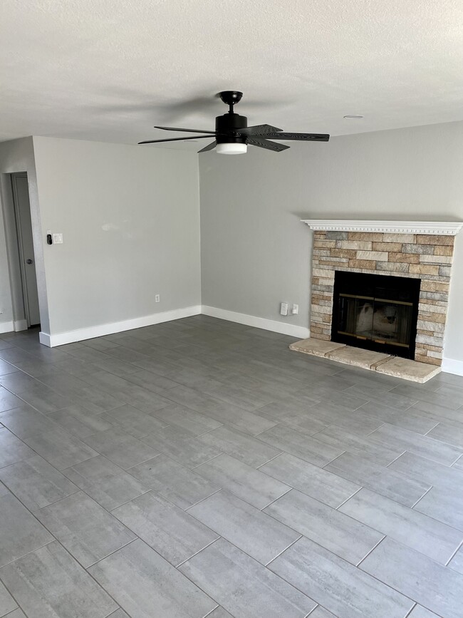 Cozy fireplace in living room - 12006 Trotwood Dr