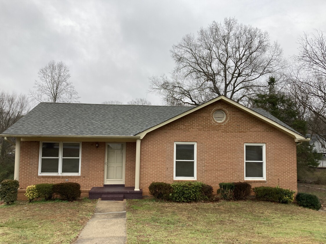 Beautiful brick home with a surprising amount of living space inside. - 5200 Peppercorn St