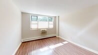 This 620 square foot apartment in Cambridge, MA offers a well-designed living space with two bedrooms and one bathroom. The unit features a modern, open-concept layout that maximizes efficiency and comfort. The kitchen boasts white cabinetry, contrasting dark countertops, and updated appliances, including a gas range and microwave. The living area seamlessly connects to the kitchen, creating a fluid space for entertaining and daily life.

Both bedrooms are generously sized, with the primary bedroom measuring 200 square feet. Large windows in the bedrooms allow ample natural light, enhancing the sense of space. The bathroom features neutral-toned tiling and a bathtub-shower combination.

Throughout the apartment, warm-toned wood flooring adds a touch of elegance and continuity. The unit is equipped with modern conveniences such as recessed lighting and in-unit climate control. Built-in storage solutions and closet space help maximize the living area.

Located at 700 Huron Ave, this apartment offers the perfect blend of urban convenience and comfortable living in a desirable Cambridge neighborhood. The efficient use of space and contemporary finishes make this an attractive option for those seeking a stylish and functional home in a prime location.