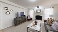Located at 1551 W 78th St S in Tulsa, Oklahoma, this thoughtfully designed single-story residence offers 1 bedroom and 2 bathrooms within a comfortable and efficient floor plan. The open-concept living and dining area serves as the heart of the home, anchored by a white-surround wood-burning fireplace flanked by windows dressed in sheer curtains and plantation shutters, filling the space with natural light. Soft carpeting flows throughout the living, dining, and bedroom areas, contributing to a warm and cohesive feel. The dining area features chair-rail molding and additional windows, offering a bright and inviting setting. The kitchen is outfitted with white upper cabinetry, gray lower cabinetry, a classic subway tile backsplash, stainless steel appliances, and a spacious white-countertop island with bar seating—ideal for both cooking and casual dining. A walk-in pantry adds valuable storage. The generously sized primary bedroom features a ceiling fan, plush carpeting, and access to a well-appointed en suite bathroom complete with a soaking tub, gray vanity cabinetry, and tile flooring. Two closets provide ample storage throughout the home. The layout is completed by a hallway connecting each functional space seamlessly.