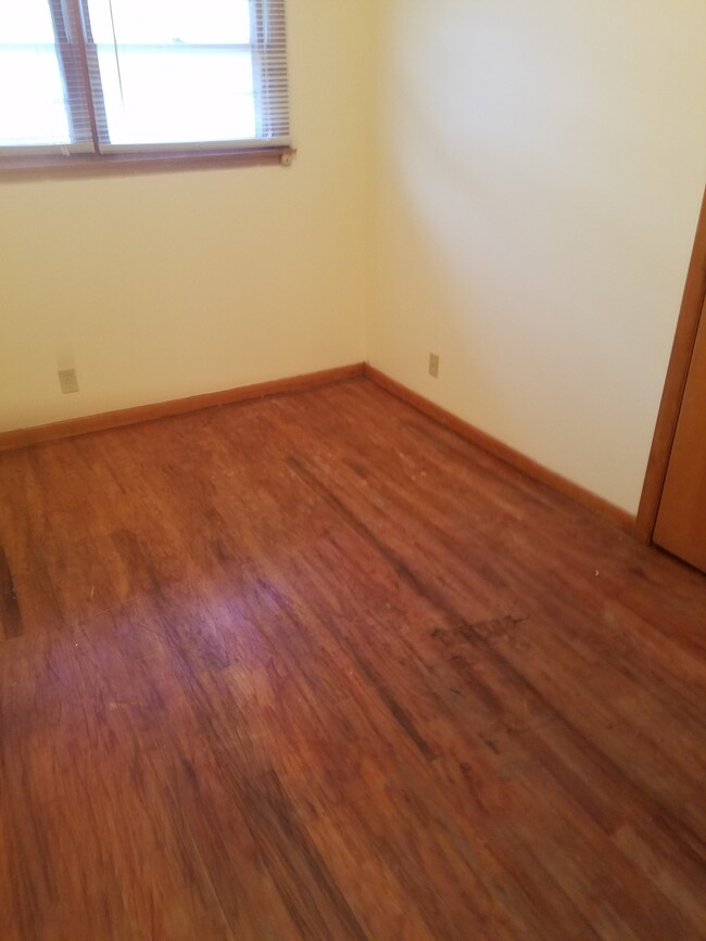 Bedrooms have vinyl wood flooring. - 735 S 2nd St