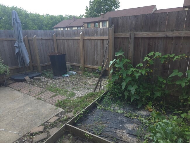Private Backyard Fully Fenced In. W/ small garden. - 7618 Thames Ct