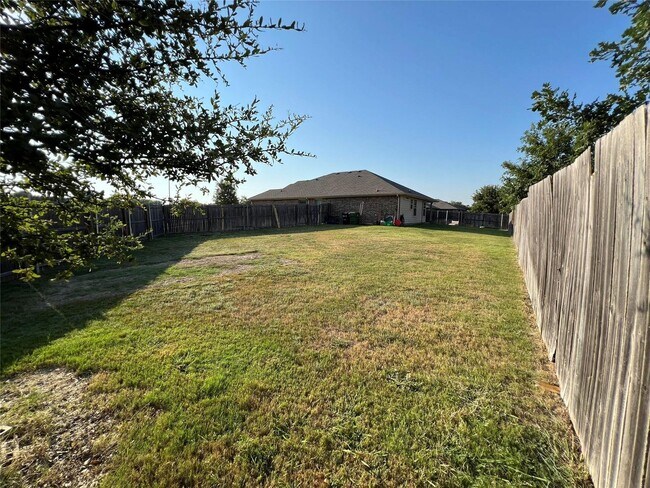 Building Photo - COMING SOON! Greenbelt Views & Giant Yard — Freshly Painted 4BR in Golden Pond