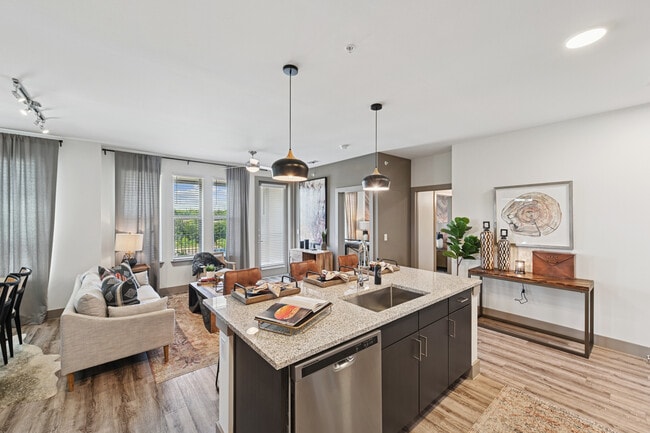 Kitchen and living room with hard surface flooring - Avalon Benbrook