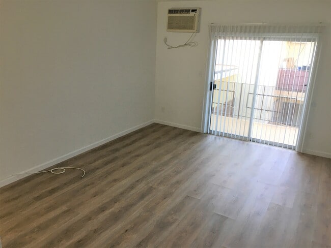 Living Room with Balcony - 5640 Fair Ave (North Hollywood, CA) Apartments