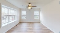 This expansive property in Legacy, Harrisburg, PA, offers a generous 1,330 square feet of living space spread across three floors. The home boasts 6 bedrooms and 3 bathrooms, providing ample space for a large family or those who enjoy hosting guests. The primary bedroom, measuring 140 square feet, offers a comfortable retreat.

The interior showcases a blend of modern design and functionality. The kitchen is a standout feature, with rich dark wood cabinetry, granite countertops, and stainless steel appliances. Large windows and sliding glass doors in the living area allow natural light to flood the space, creating an open and airy atmosphere.

Throughout the home, you'll find a mix of carpeted and hardwood flooring, adding warmth and character to each room. The bathrooms are tastefully appointed, featuring granite vanities and modern fixtures. A dedicated laundry room with full-sized washer and dryer adds convenience to daily living.

Storage space is plentiful, with walk-in closets in bedrooms and additional storage areas throughout. The home's neutral color palette provides a blank canvas for personalization, while recessed lighting and ceiling fans contribute to the overall modern aesthetic.

With its spacious layout, contemporary finishes, and prime location in Harrisburg, this property offers a perfect blend of comfort and style for discerning homeowners.