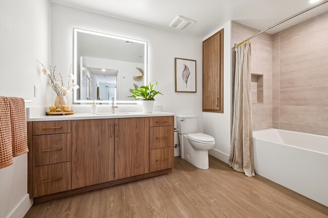 Beautiful bathroom with large tiled tub - AMLI Aero Apartments