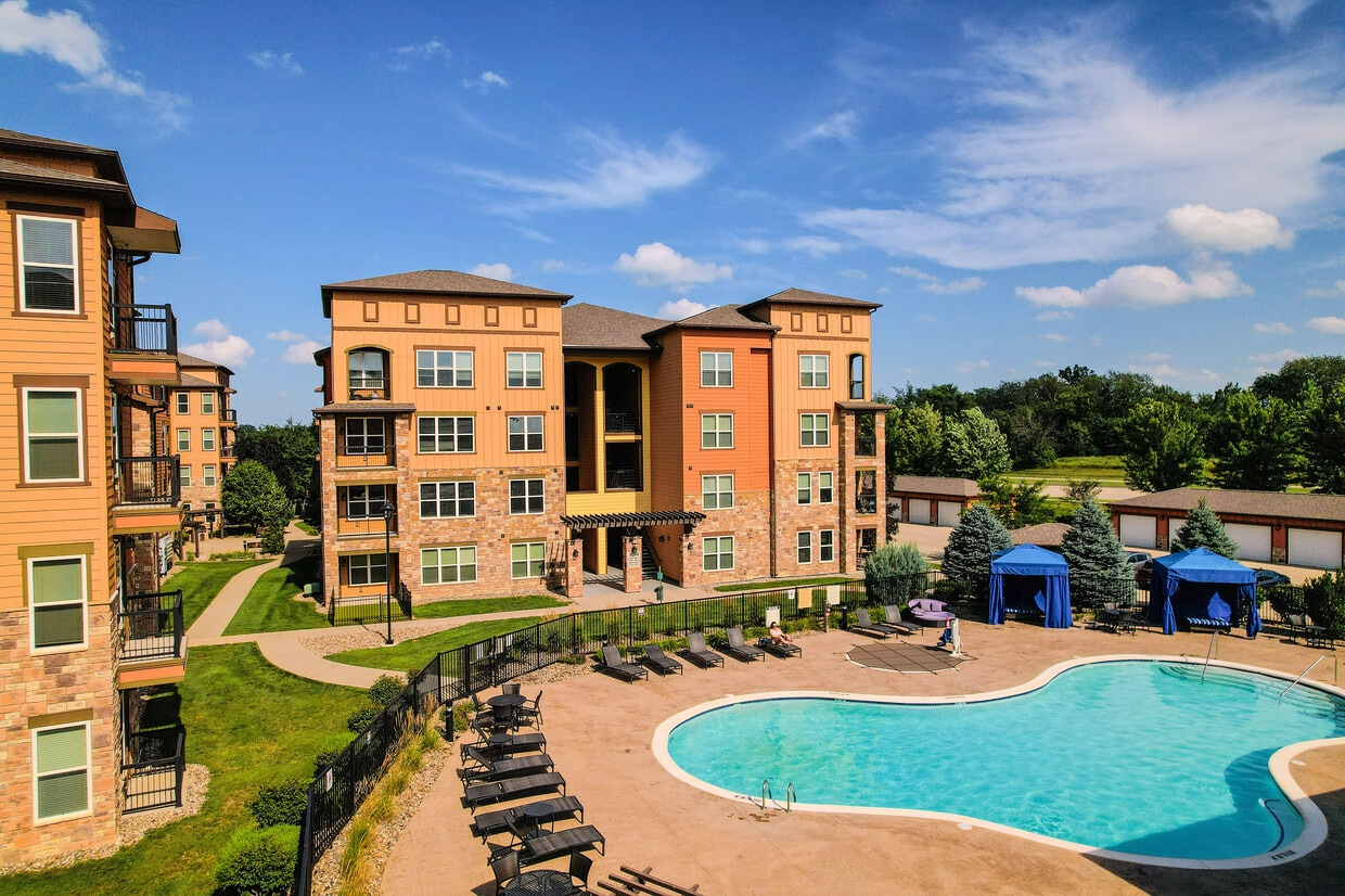 Dive into relaxation or gather with neighbors by our pool. - Watermark at Jordan Creek