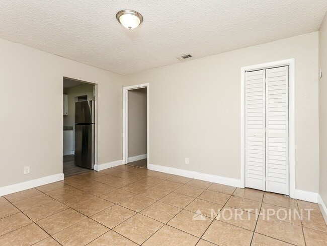 Building Photo - 3 BR/1BA | Newly Renovated Single Family Home | Screened in Patio and carpot | Huge backyard!
