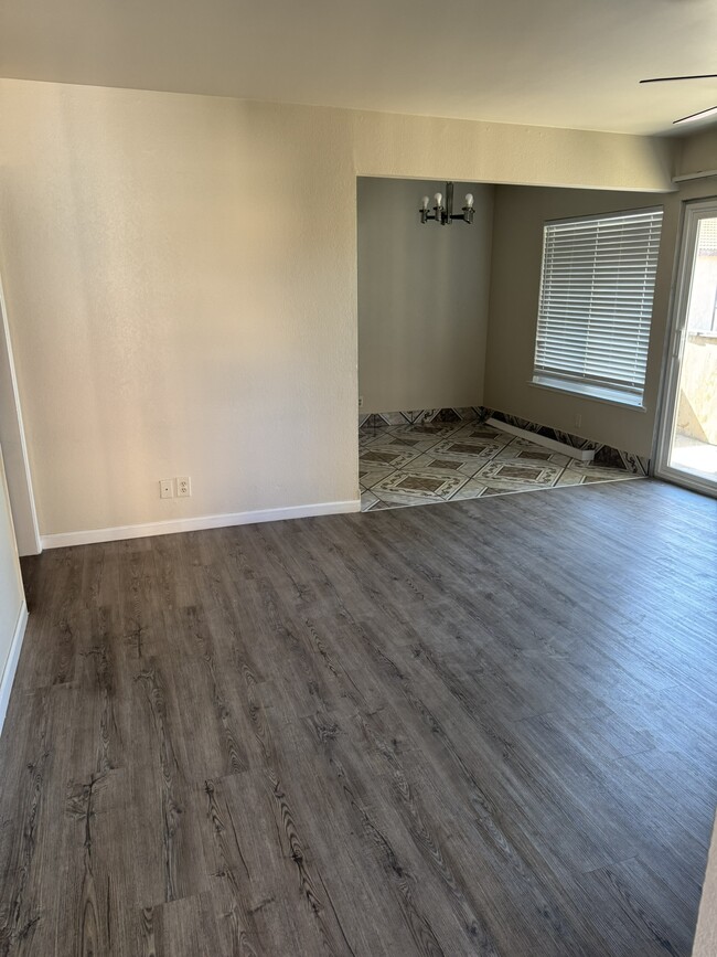 View of Living Area and Dining Area from Doorway Entry - 1550 W Ashlan Ave