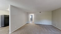 Located in Charlotte, NC, this single-floor, 3-bedroom, 1-bathroom home offers a practical and comfortable layout. The kitchen is a functional highlight, featuring white cabinetry with ample storage, light stone-look countertops, hardwood-style vinyl flooring, and black appliances including a refrigerator, electric range, dishwasher, and overhead ventilation. The living areas are finished with neutral gray walls and plush carpeting, creating a calm and cohesive aesthetic throughout. The spacious primary bedroom provides generous room for furnishings and includes a closet with sliding doors. The two additional bedrooms are each carpeted and benefit from natural light through windows, with one also featuring a built-in closet. A hallway connects the bedrooms, providing a logical and efficient flow through the home. The full bathroom is cleanly appointed with a white vanity, granite-look countertop, framed mirror, and a full tub-shower combo with light hardwood-style flooring. A dedicated closet offers additional storage. Neutral tones are used consistently across the home, giving each room a clean, move-in ready appearance. This well-organized home is a solid option for those seeking functional living in Charlotte.