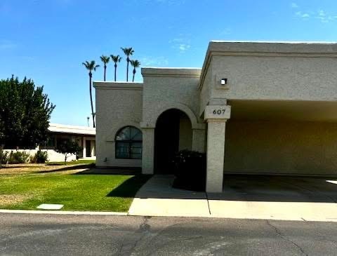 Beautiful skylines all around with palms. Italian style entrance. One car covered carport. - 607 S 79th Way