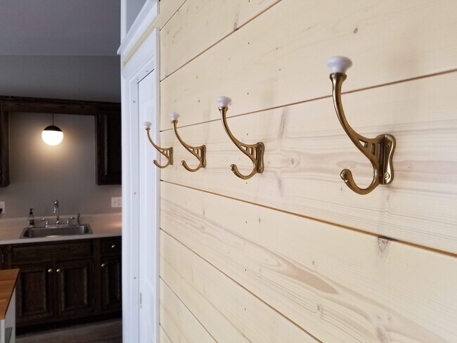 Shiplap Entry Wall, Brass Hooks - 2505 Victoria Ave