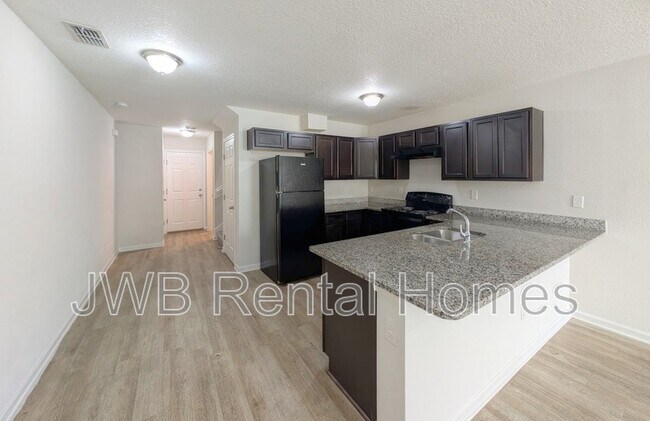 Building Photo - 8476 McGirts Village Ln