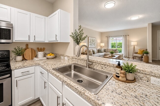 Mejora tu estilo de vida en Delray Bay con esta cocina de diseño elegante, que cuenta con acabados modernos y una distribución espaciosa. Disfruta de delicias culinarias en un espacio luminoso y acogedor. ¡Descubre hoy mismo tu futuro hogar! - Delray Bay Apartments