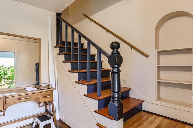 Stairs from shared foyer up to the unit. - 4130 SE Cesar E Chavez Blvd
