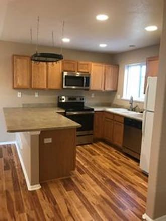 Stainless appliances in kitchen (new refrigerator installed 1/25). New washer dryer as well.. - 14230 Woodrock Path