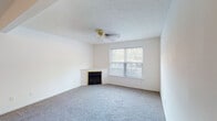 Located at 9005 Pegasus Pointe Dr in Louisville, KY, this single-floor residence offers a practical and well-maintained layout designed for comfortable everyday living. The home's interior is finished with a neutral color palette throughout, creating a clean and versatile backdrop.

The living area is a notable highlight, featuring plush carpeting, a textured ceiling, a ceiling fan, and a fireplace framed by a light-toned surround. A large window allows natural light to fill the room, contributing to an open and welcoming ambiance. The entryway transitions seamlessly from wood-look plank flooring near the front door into the carpeted living space.

The kitchen is well-equipped with warm-toned wooden cabinetry providing generous storage above and below the counters. It includes a double-basin sink, a coil-element range, a dishwasher, and wood-look flooring that ties the space together cohesively.

The bedrooms are carpeted and include ceiling fans and windows for natural light. Closets with built-in hanging rods provide practical storage solutions in the sleeping areas.

The bathroom features wood-look flooring, a combination tub and shower with a curtain rod, a toilet, and a vanity with warm wood cabinetry and a light-toned countertop. Overall, the home presents a functional and tidy living environment.