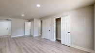 Located at 106 Frances Dr in Byron, Georgia, this single-story, 2-bedroom, 2-bathroom home offers a thoughtfully organized layout with clean, modern finishes throughout. The living room greets you with light wood-look luxury vinyl flooring, neutral gray walls, recessed lighting, and a bright window that invites natural light, creating a welcoming and open atmosphere.

The kitchen is efficiently designed with crisp white shaker-style cabinetry, granite-look countertops, a black matte sink fixture, and a full suite of stainless steel appliances including a refrigerator, oven range, and dishwasher. Light wood-look flooring continues seamlessly from the main living areas.

Both bedrooms feature plush neutral carpeting, ceiling fans with light fixtures, and closets with panel doors. The primary bedroom includes a dedicated closet and direct access to a hallway, while the second bedroom mirrors the same cozy, functional design.

The two bathrooms are finished with white cabinetry, granite-look countertops, black matte hardware, and full tub-shower combinations with built-in shelving — a consistent and stylish touch. Light tile flooring completes the clean aesthetic.

Two closets provide practical storage throughout the home. The overall design palette of whites, grays, and natural wood tones creates a cohesive, move-in-ready environment suited for comfortable everyday living.