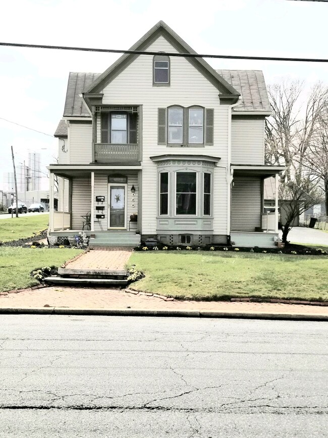 exterior of front 2 units - 120 E 8th St