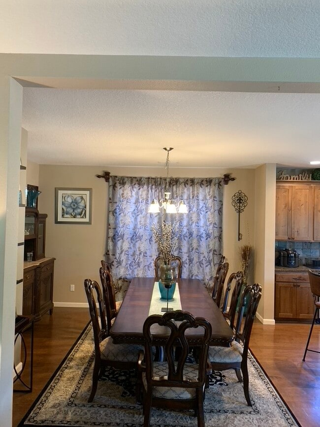 Dining table seats up to 8. - 5401 NE 66th Dr