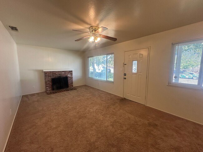Building Photo - Three Bedroom Two Bathroom Home with Yard