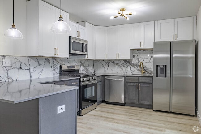 Quartz Countertops + Designer Backsplash - Cadence of Newport Apartments