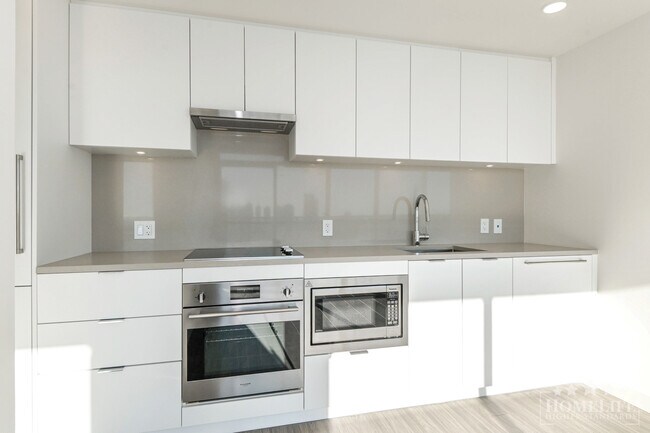 Building Photo - Welcome to Flamingo One, a landmark tower in Surrey Central!